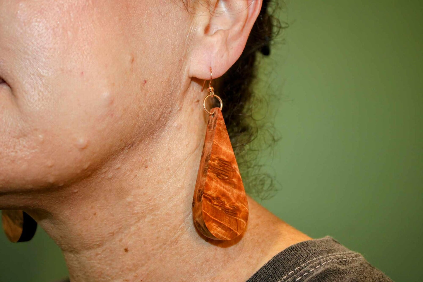 Handmade wooden earrings with polished thuya burr wood in a teardrop shape with rose gold or sterling silver shepherd hypoallergenic hooks